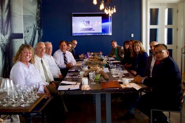 board members at long lunch table