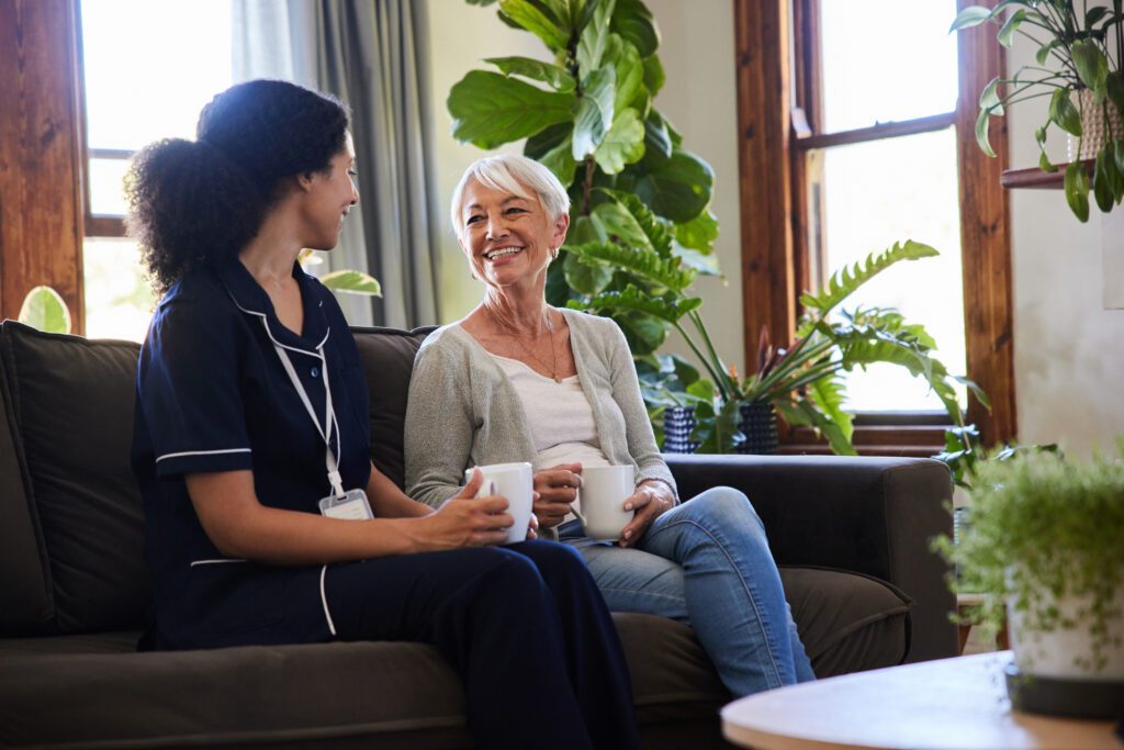 doctor speaking patient on couch