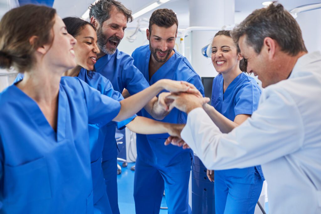 nurse team huddled for cheer