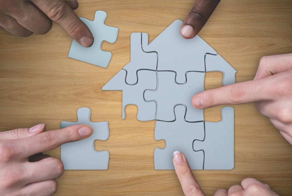 a perfect fit of puzzle pieces of a house